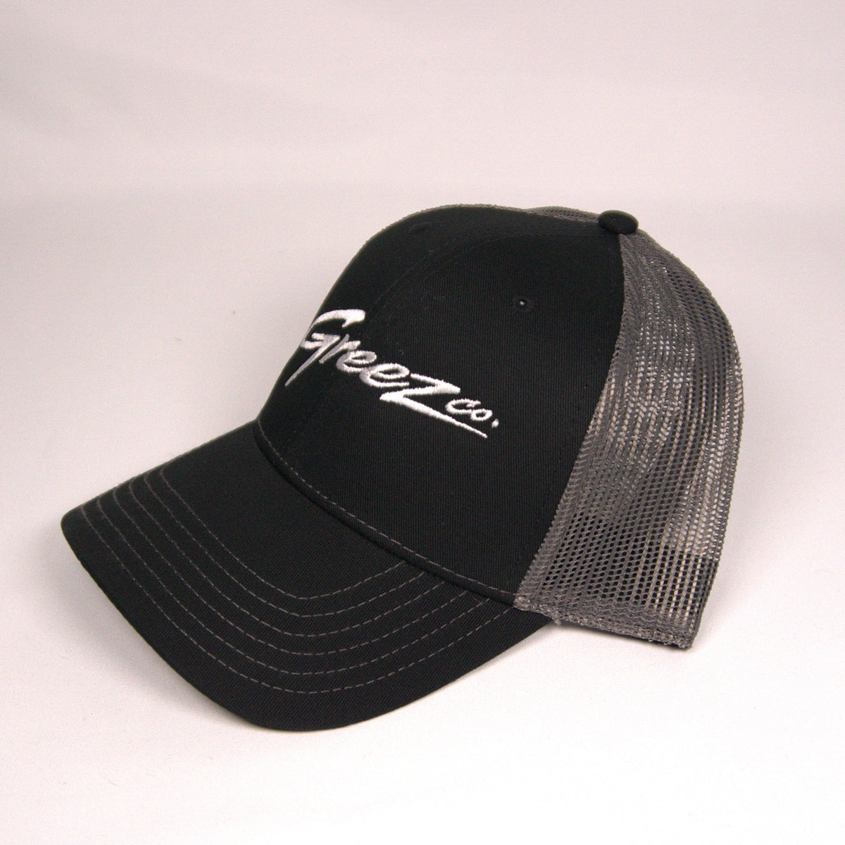 Greez Co. Classic Trucker Hat – Black/Gray